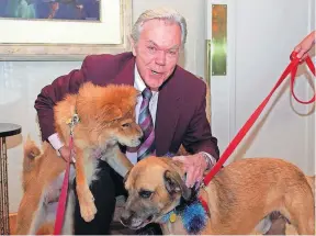  ?? [AKRON BEACON JOURNAL FILE PHOTO] ?? Meteorolog­ist Dick Goddard was an advocate for abused and neglected pets, helping get what was called Goddard’s Law passed that made knowingly inflicting serious harm to a pet a felony in Ohio.