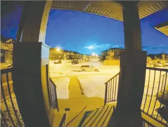  ?? MELANIE BABINEAU/VIA REUTER ?? A blue fireball flares up in the sky over Cochrane in this still image obtained from a social media video. The comet piece was travelling 220,000 km/h when it entered Earth's atmosphere.