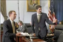  ?? J. SCOTT APPLEWHITE — THE ASSOCIATED PRESS ?? Then-House Budget Committee Chairman Rep. Paul Ryan, R-Wis., right, greets Congressio­nal Budget Office (CBO) Director Douglas Elmendorf on Capitol Hill in Washington.