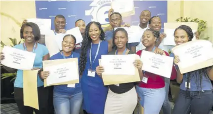  ??  ?? Nadeen Matthews Blair surrounded by NCB Foundation scholars from the 2019 cohort.