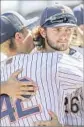  ?? Nati Harnik Associated Press ?? GAVIN VELASQUEZ (42) and Connor Seabold comfort each other after Fullerton’s loss.