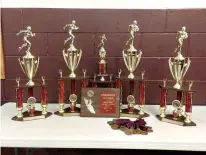  ??  ?? n All the trophies and medals for the regional track and field event at New Boston, Texas, have been inscribed with the new name—Sid “Jet” Garton Relays. Garton is a record-setting sprinter who graduated from New Boston in 1958. Coach Jamey Thomas...