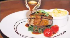  ??  ?? Grass-fed tenderloin steak with foie gras.