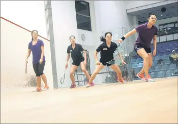  ?? — Bernama file photo ?? squash players compete in the women’s doubles event.