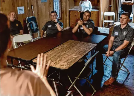  ?? Photos by Josie Norris/staff photograph­er ?? SAPD Officer Joel Pope, left, and cadets Derek Martinez, Josh Barrientes and Spencer Nicholson attend a Community Immersion Program session Wednesday at Christian Assistance Ministry.