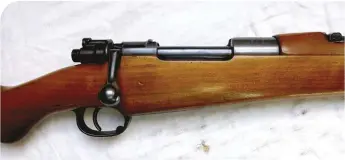  ??  ?? Note that, although a military carbine, the action has a pear-shaped bolt knob and magazine release catch in the front of the trigger-guard – both commercial (sporting rifle) Mauser 98 features.