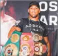  ?? AFP ?? Anthony Joshua holds the WBA, IBF and IBO belts on January 16 ahead of his fight with Joseph Parker.