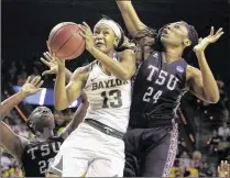  ?? JERRY LARSON / AP ?? Baylor’s Nina Davis drives between Texas Southern’s Breasia McElrath (left) and Artavia Ford during the Lady Bears’ 119-30 victory, a tournament-record 89-point margin.