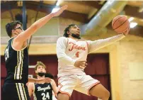  ?? ?? Tinley Park’s Malachi Haythorne puts up a shot around Avila.