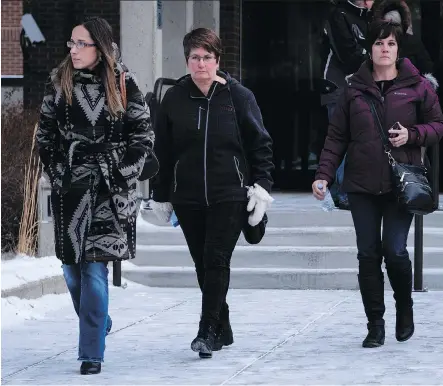  ?? JEFF MCINTOSH/THE CANADIAN PRESS ?? Marilyn Thomson, second from left, aunt of Jason Klaus, leaves court after Joshua Frank and Klaus were found guilty by a judge in Red Deer on Wednesday. The pair were found guilty of first-degree murder in the deaths of Klaus’s parents and sister in a...