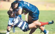  ?? TOUGH GOING: Queensland Country's Jordan Petaia barges over Melbourne's Tom English. ??