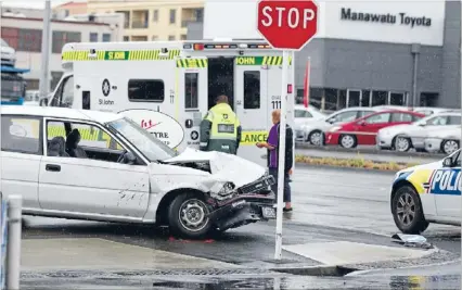  ?? Photos: MURRAY WILSON/FAIRFAX NZ ?? Two people were taken to hospital after this car and another collided at the corner of Walding and Taonui streets in Palmerston North yesterday afternoon.