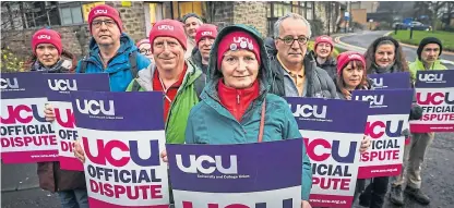  ?? Picture: Mhairi Edwards. ?? Ann Swinney, senior lecturer at Dundee University and UCU branch president, alongside other members striking.