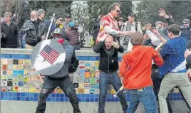  ?? REUTERS ?? MAKE AMERICAN FIGHT AGAIN: Supporters of Donald Trump clashed with counterpro­testers at a rally in the city of Berkeley, California, on a day of mostly peaceful gatherings in his support. Protesters struck one another over the head with wooden sticks...
