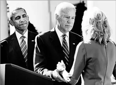  ?? JACQUELYN MARTIN/ASSOCIATED PRESS ?? Vice President Joe Biden announces his decision with his wife, Jill, and President Barack Obama flanking him Wednesday.