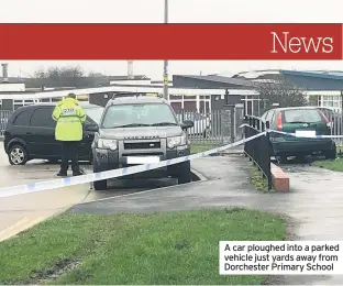  ??  ?? A car ploughed into a parked vehicle just yards away from Dorchester Primary School