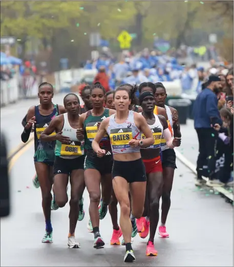  ?? PHOTO BY REBA SALDANHA — BOSTON HERALD ?? American Emma Bates leads the women’s race in Newton during the 127th Boston Marathon on April 17, 2023.
