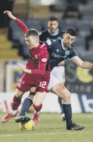  ?? ?? 0 St Mirren midfielder Jay Henderson, left, vies with Dundee’s Shaun Byrne at Dens Park last night