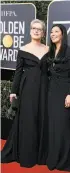  ?? Valerie Macon / AFP/ A Getty Images ?? Meryl Streep (left) and Ai-jen Poo, of the National Domestic Workers Alliance, wore black to the Golden Globes.