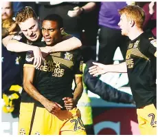  ??  ?? LEVEL: Jevani Brown celebrates scoring United’s equaliser