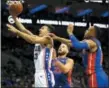  ?? LAURENCE KESTERSON — THE ASSOCIATED PRESS ?? Philadelph­ia 76ers guard Landry Shamet (23) goes to the basket past Detroit Pistons forward Blake Griffin (23) and guard Bruce Brown (6) during the second half on an NBA basketball game, Saturday.