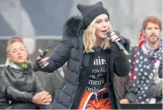  ??  ?? Madonna addresses protesters at the Women’s March in Washington DC on Saturday.