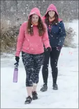  ??  ?? April Leadley, left, and Brianna Kripwell complete their 10,000 steps.