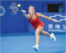  ?? — AFP ?? Simona Halep of Romania hits a return against Duan Yingying of China at the WTA Shenzhen Open in Shenzhen, China’s Guangdong province.