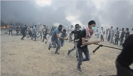  ?? ADEL HANA THE ASSOCIATED PRESS ?? Anger flares during a protest at the Gaza Strip's border with Israel on May 4. Three days later, a volatile situation exploded and shocked the world.