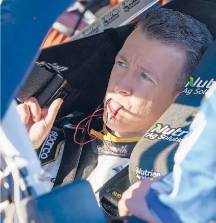  ?? JOHN RAOUX/AP ?? A J Allmending­er gets ready for the NASCAR Xfinity Series on Saturday at Daytona Internatio­nal Speedway.