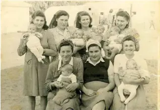  ?? (Courtesy) ?? BABIES BORN at sea. Mina is standing, second from left.