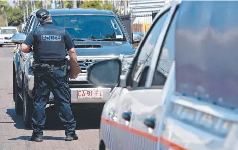  ?? Picture: MICHAEL FRANCHI ?? NT Police recover a Toyota HiLux on De Latour St in Coconut Grove which was stolen from nearby cafe Ruby G's with a three-year-old girl sitting in the back seat