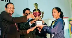  ??  ?? Museaus Team Captain receiving the Champion’s Trophy from the Chief Guest