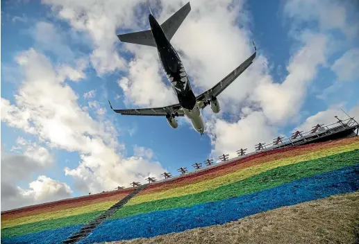  ?? ROBERT KITCHIN/STUFF ?? A rainbow flag ‘‘flies’’ proudly at the northern end of the Wellington Airport runway.