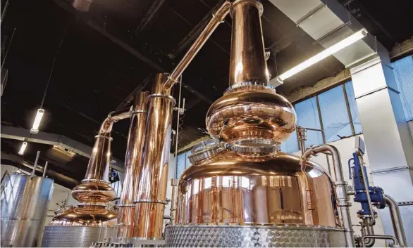  ??  ?? Margaret and Frances go about their business at the Glasgow Distillery Company’s Hillington facility in the south of the city. Left, the third and final product in the distiller’s Signature Range, the Glasgow 1770 – Triple Distilled Release No.1