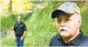  ?? RUBINKAM/AP MICHAEL ?? In this Sept 2018 photo, Dennis Parada, right, and his son Kem Parada stand at the site of the FBI’s dig for Civil Warera gold in Dents Run, Pa.