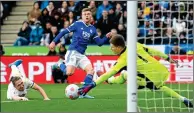  ?? ?? SLIDE RULE: Barnes bends his shot round Leeds keeper Illan Meslier to put Leicester in front with 23 minutes left