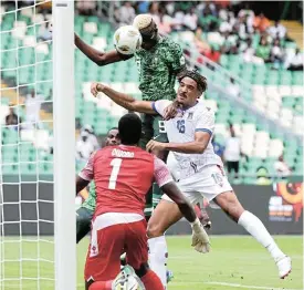  ?? /Gavin Barker/BackpagePi­x ?? Rising to the occasion: Victor Osimhen scores for Nigeria with a header in their match against Equatorial Guinea at the Africa Cup of Nations in in Abidjan on Sunday.