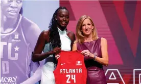  ?? Photograph: Sarah Stier/ Getty Images ?? Nyadiew Puoch poses with WNBA commission­er Cathy Engelbert after being selected 12th overall pick by the Atlanta Dream during the 2024 WNBA draft.