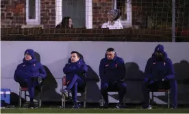  ??  ?? José Mourinho and his coaching staff watch on during Spurs’ FA Cup win at eighth-tier Marine AFC. Photograph: Tottenham Hotspur FC/Getty Images