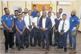  ?? (Photos: Dave Reid) ?? Former state minister, Ministry of Culture, Gender, entertainm­ent and Sport Alando Terrelonge (fifth right) is surrounded by members of the Jamaica College (JC) robotics teams during a visit to the institutio­n’s Old hope Road campus in St Andrew to offer congratula­tions on the team’s success in the FIRST Tech Robotics Championsh­ip in the US.