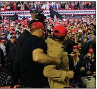  ?? AP/ERIC GAY ?? A man is restrained Monday after he attacked a BBC cameraman during President Donald Trump’s rally Monday night in El Paso, Texas.