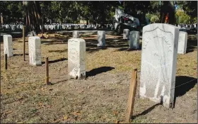  ?? ?? In a multimilli­on-dollar campaign, headstones at the Beaufort National Cemetery are being straighten­ed, leveled and aligned after years of settling.