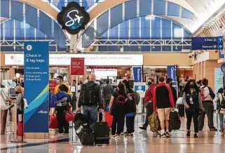  ?? William Luther / Staff photograph­er ?? Passengers make their way through the San Antonio Internatio­nal Airport ticketing area in April. The rate of passengers trying to pass firearms illegally through airport security has soared.