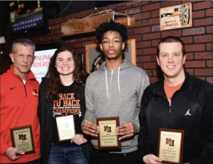  ?? PAUL DICICCO — FOR THE NEWS-HERALD ?? From left, Mentor’s Bob Krizancic, North’s Destiny Leo, Benedictin­e’s Davin Zeigler and North’s Paul Force pose with their respective coach and player of the year awards March 19 at Hooley House.