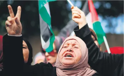  ?? Picture: AFP ?? BLOOD PLEDGES. Palestinia­n women protest yesterday at the offices of the United Nations special coordinato­r for the Middle East Peace Process over the US president’s decision on Jerusalem.