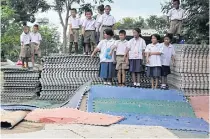  ?? PRASIT TANGPRASER­T ?? In this file photo, students point to allegedly substandar­d mats used in a futsal field in Nakhon Ratchasima.