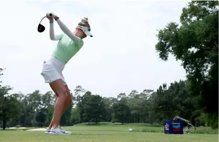  ?? AFP/VNA Photo ?? TEE TIME: Nelly Korda of the United States plays her shot from the 13th tee during the Woods on April 18 in the Woodlands, Texas.
rst round of the Chevron Championsh­ip at the Club at Carlton