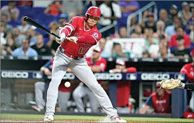  ?? LYNNE SLADKY / AP ?? Los Angeles Angels’ Shohei Ohtani swings at a pitch during the seventh inning of the team’s baseball game against the Miami Marlins on Tuesday in Miami.