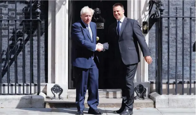  ?? Agence France-presse ?? ↑ Boris Johnson greets Estonian Prime Minister Juri Ratas at 10 Downing Street in central London on Tuesday.